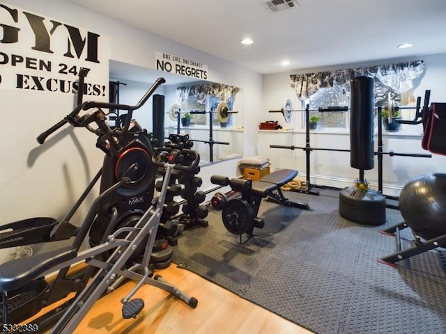 workout area featuring wood-type flooring