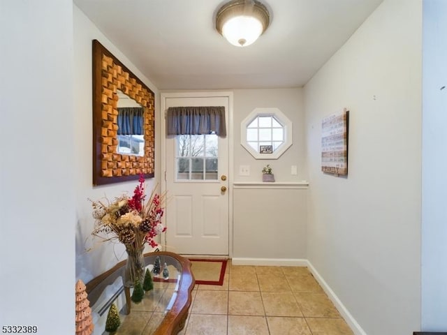 doorway with light tile patterned floors