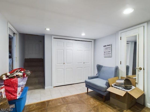 living area featuring light tile patterned flooring