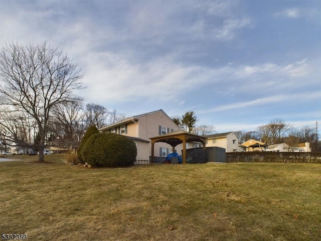 view of side of home featuring a yard