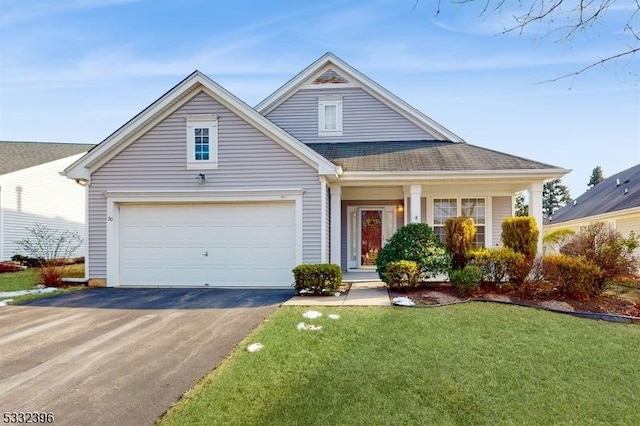 view of front facade with a front yard and a garage