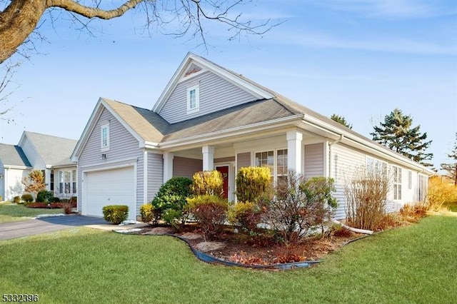 view of front facade with a front lawn and a garage