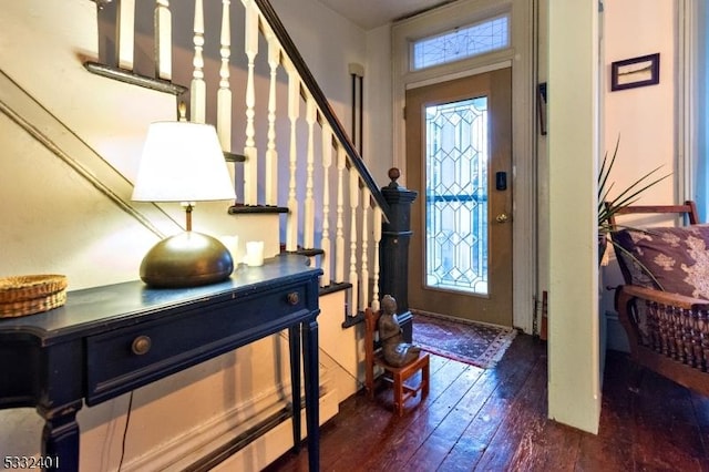 foyer with dark hardwood / wood-style flooring