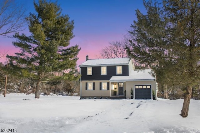 view of front of home with a garage