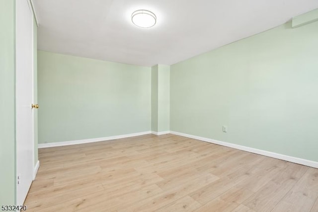 unfurnished room with light hardwood / wood-style flooring