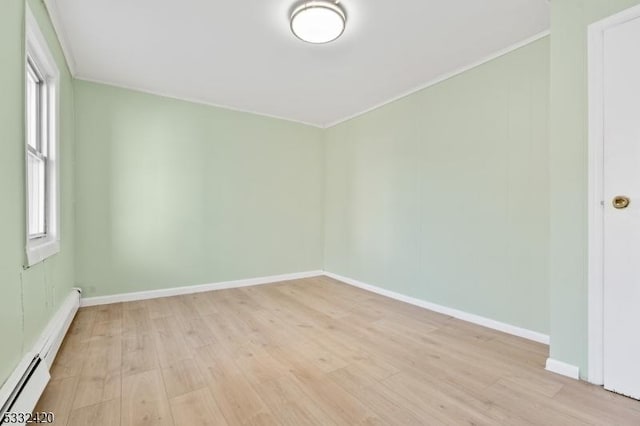 bonus room featuring light hardwood / wood-style flooring and a baseboard heating unit