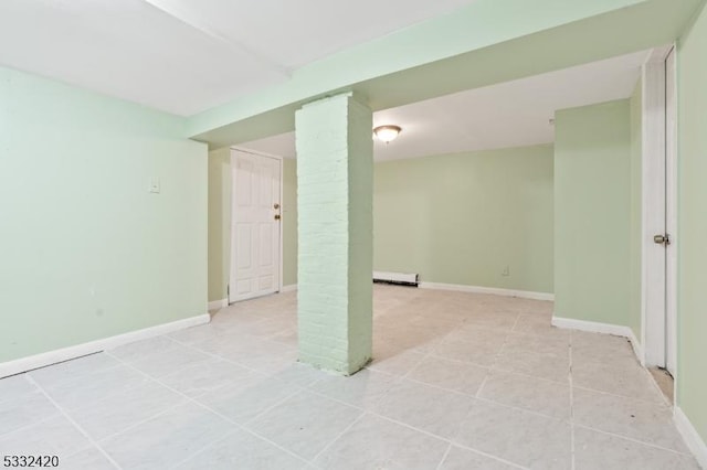 basement featuring a baseboard heating unit