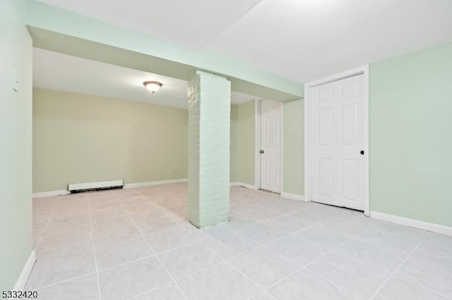 basement with light tile patterned flooring