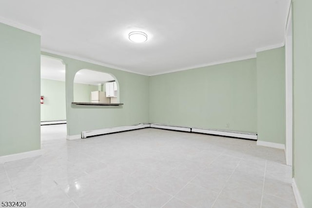 spare room featuring crown molding and a baseboard radiator