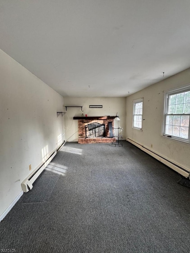 unfurnished living room with a fireplace, carpet, and a baseboard heating unit