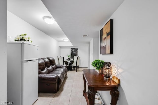 living room with light tile patterned floors