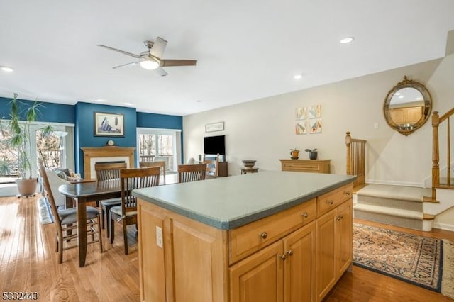 kitchen featuring ceiling fan and light hardwood / wood-style flooring