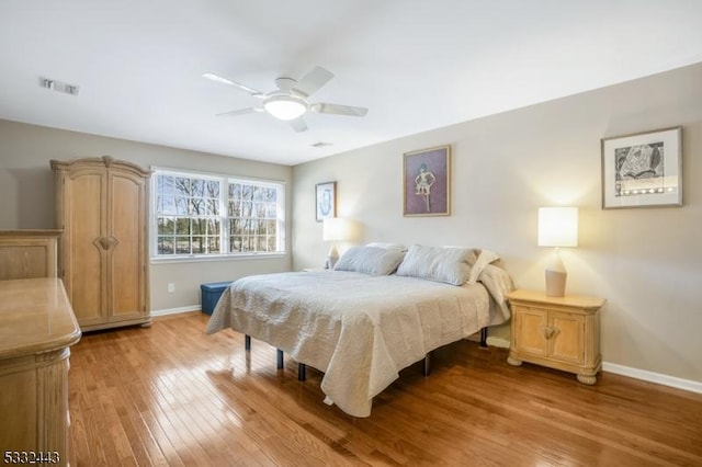 bedroom featuring ceiling fan and light hardwood / wood-style flooring