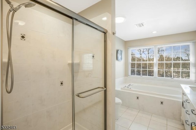 full bathroom featuring separate shower and tub, vanity, tile patterned floors, and toilet