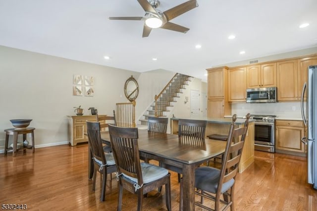 dining room featuring ceiling fan and light hardwood / wood-style floors