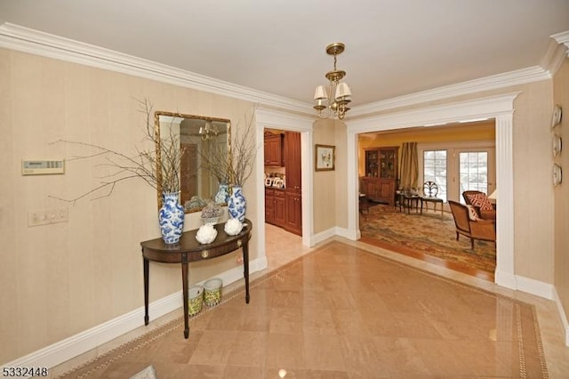 corridor featuring crown molding and a chandelier