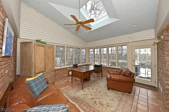 sunroom / solarium with ceiling fan and lofted ceiling with skylight