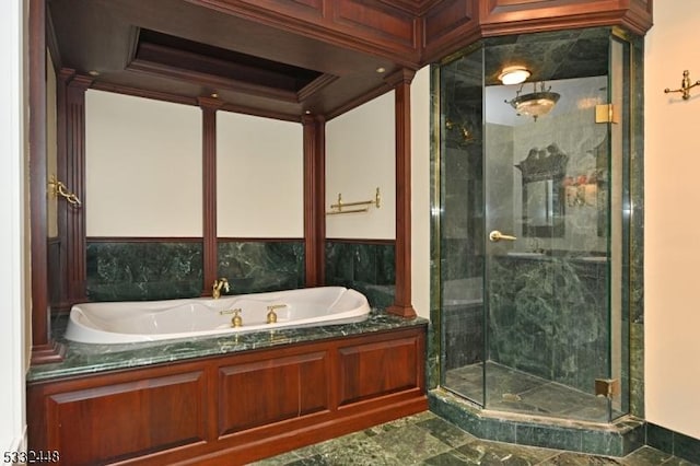 bathroom with separate shower and tub and ornamental molding