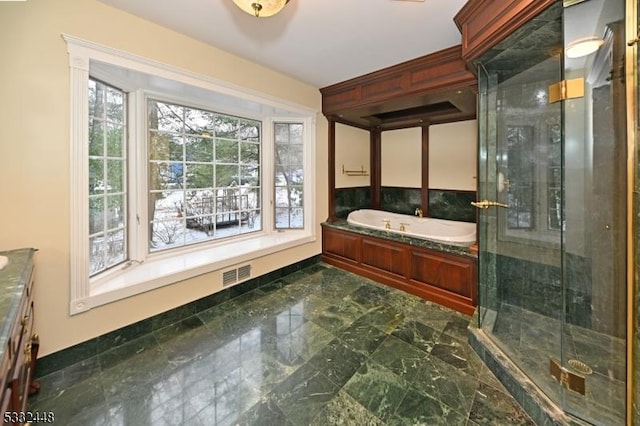 bathroom with vanity and plus walk in shower