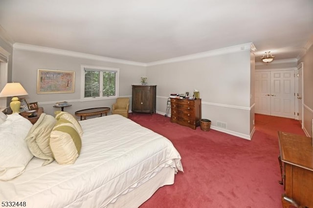 bedroom with dark carpet and crown molding