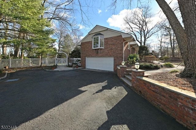 view of property exterior featuring a garage