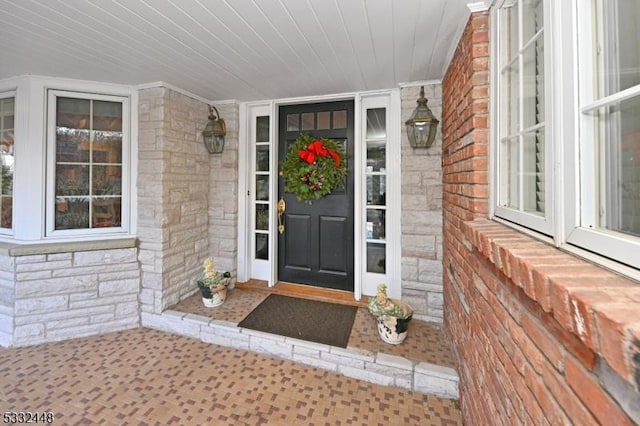 doorway to property with a porch