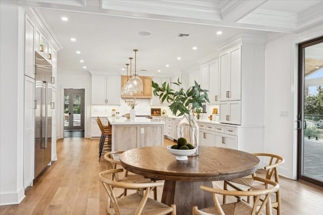 dining room featuring french doors, coffered ceiling, crown molding, beamed ceiling, and light hardwood / wood-style floors