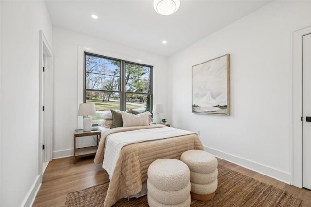 bedroom with hardwood / wood-style floors