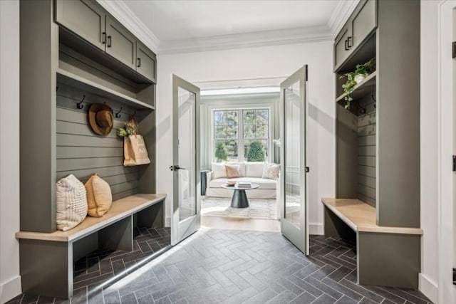 mudroom featuring crown molding