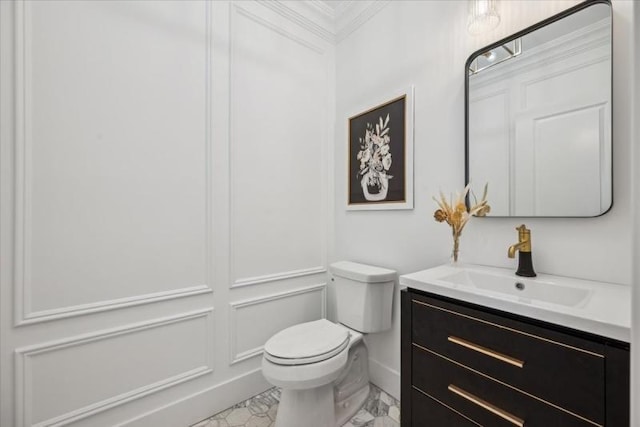 bathroom featuring vanity and toilet