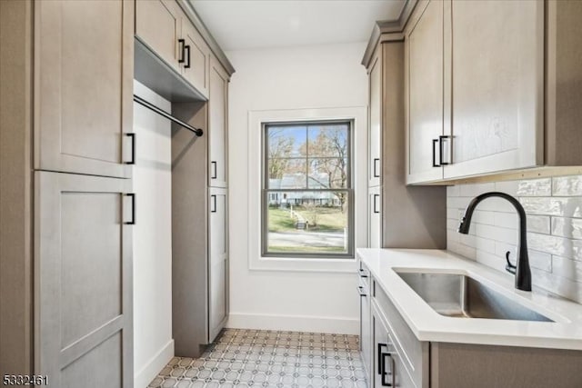 kitchen with backsplash and sink