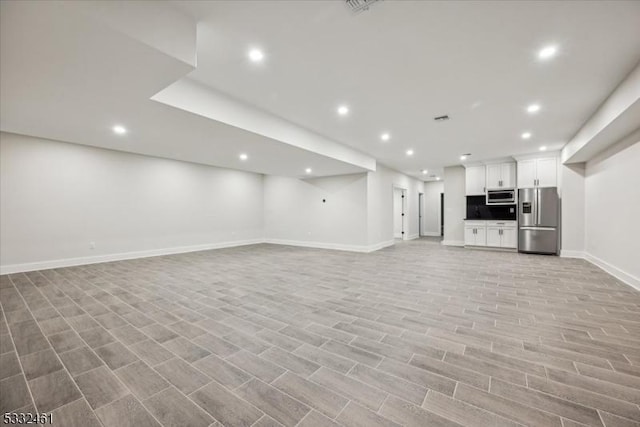 unfurnished living room featuring light hardwood / wood-style flooring