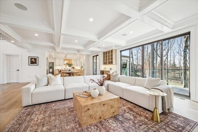 living room featuring beam ceiling, crown molding, and coffered ceiling