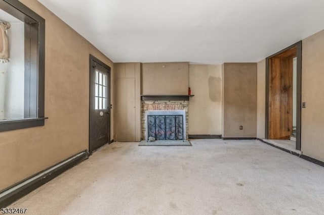 unfurnished living room featuring a fireplace