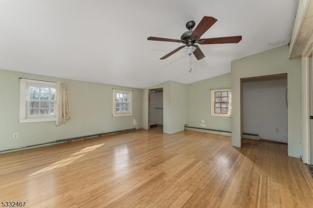 unfurnished bedroom with ceiling fan, a baseboard radiator, light wood-type flooring, and lofted ceiling