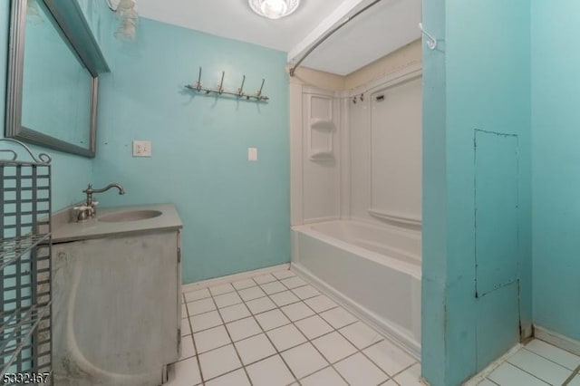 bathroom with tile patterned floors, bathing tub / shower combination, and vanity