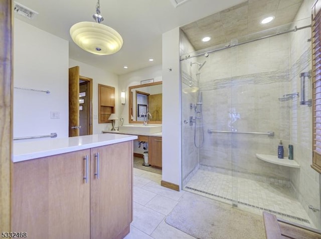 full bathroom with recessed lighting, visible vents, vanity, tile patterned floors, and a stall shower