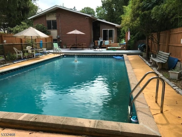 view of pool featuring a fenced in pool and a fenced backyard