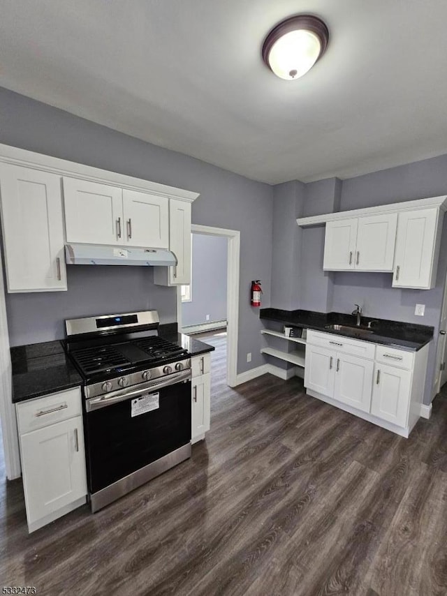 kitchen featuring sink, white cabinetry, dark wood-type flooring, and stainless steel range oven