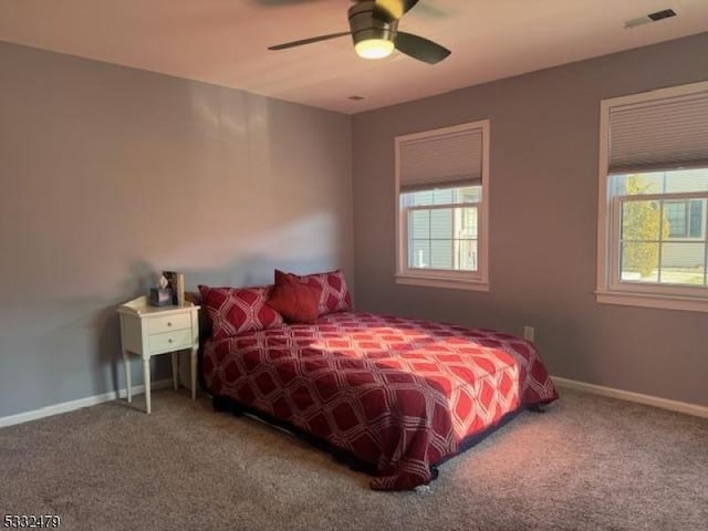 bedroom with ceiling fan and carpet floors