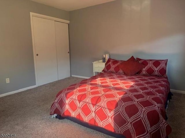 carpeted bedroom with a closet