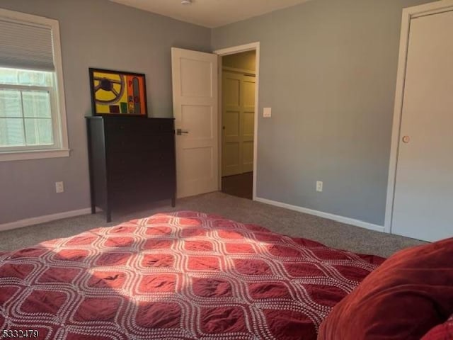 bedroom featuring light carpet