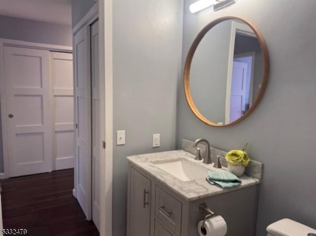 bathroom featuring toilet and vanity