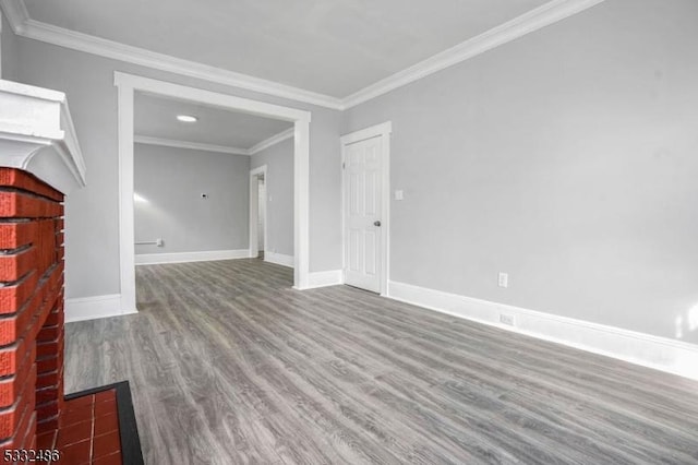 empty room featuring hardwood / wood-style flooring and crown molding