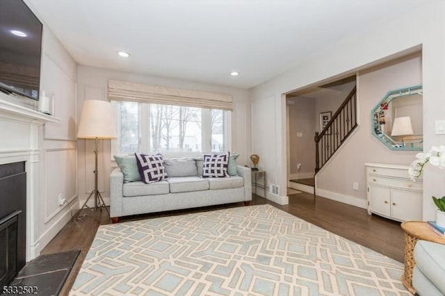 unfurnished living room featuring dark hardwood / wood-style flooring