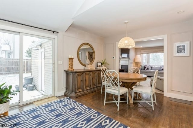 dining area featuring dark wood-type flooring