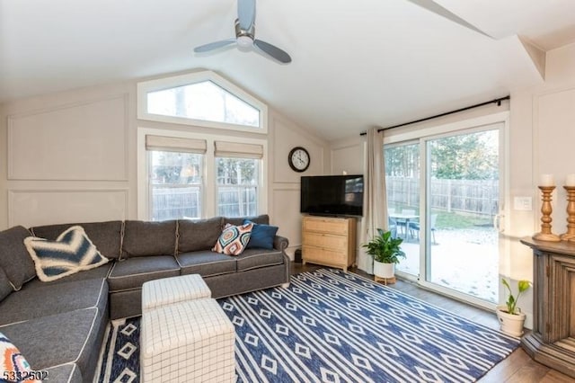 living room featuring lofted ceiling, ceiling fan, and hardwood / wood-style flooring