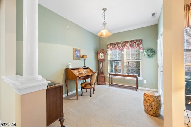 office space with light colored carpet and ornate columns