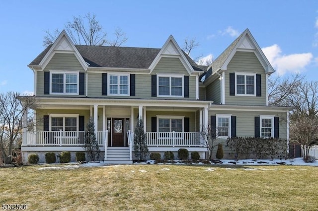 view of front facade featuring covered porch and a front lawn