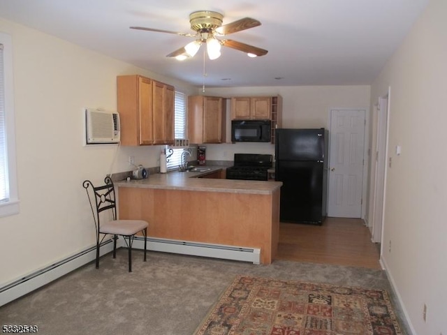 kitchen featuring ceiling fan, sink, kitchen peninsula, light carpet, and black appliances